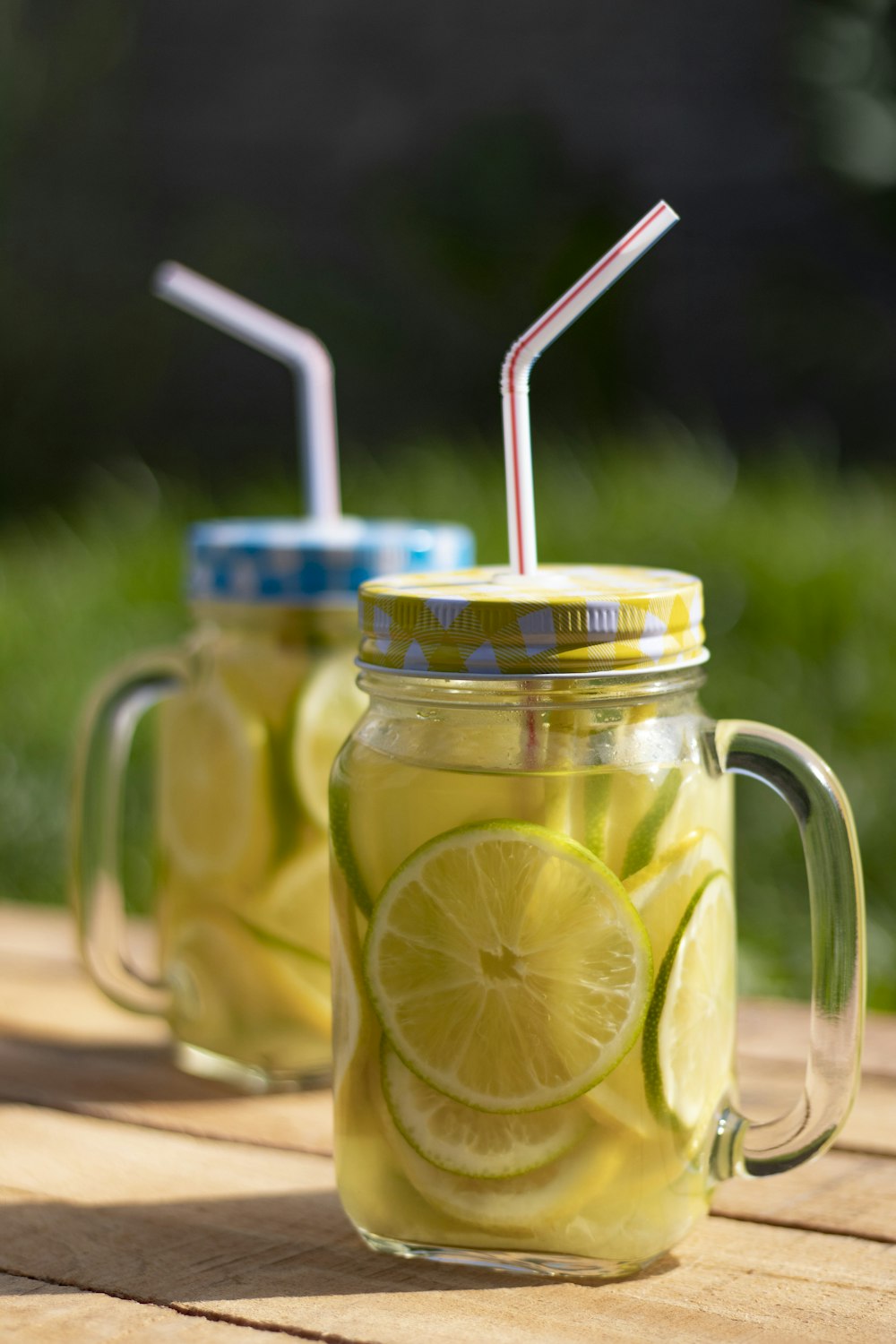 clear glass mason jar with yellow liquid