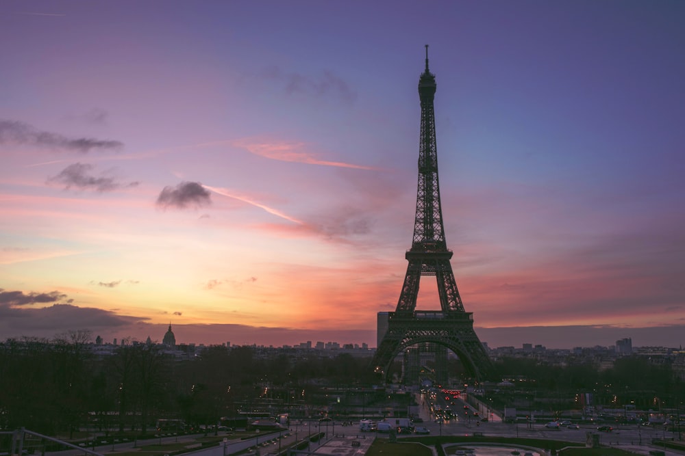 eiffel tower under orange and blue sky