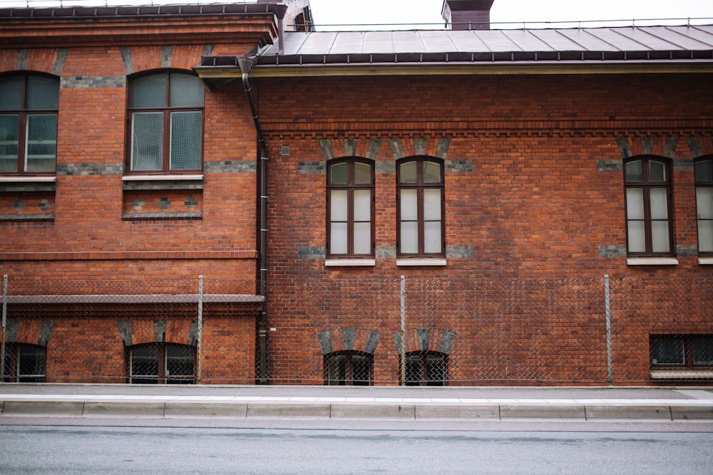brown brick building with windows