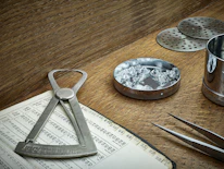 Close-up of a jeweler using AI-powered tools to analyze gemstones.