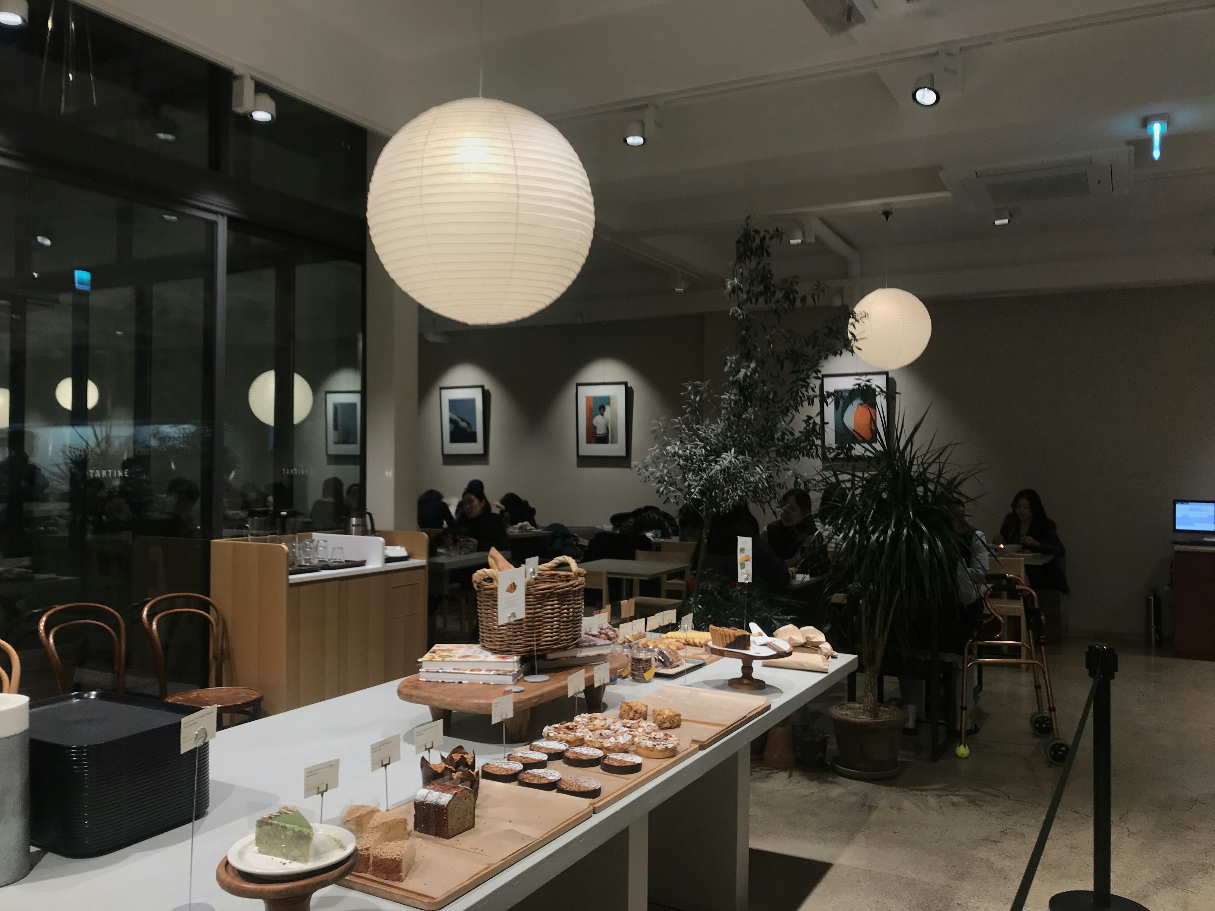 White pendant lamp over wooden table
