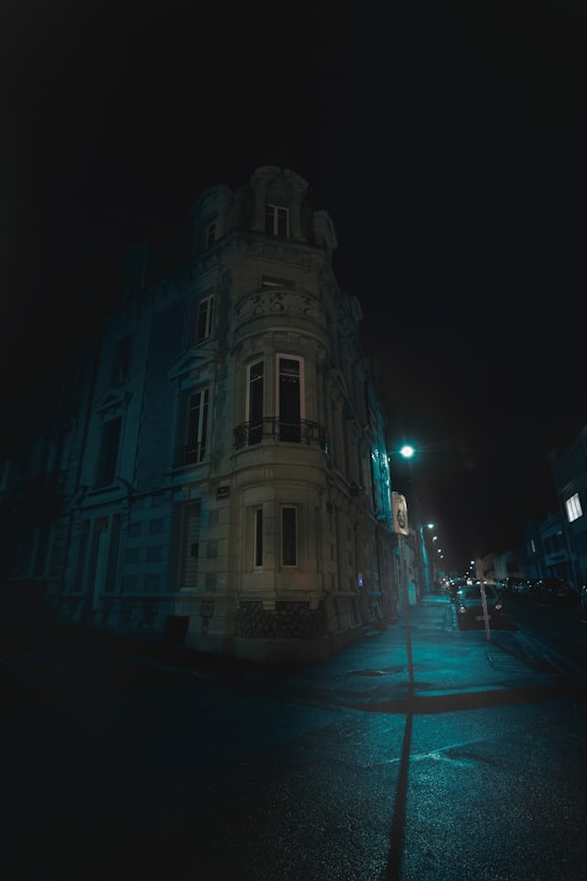 white concrete building during night time in Rue Saint-Martin France