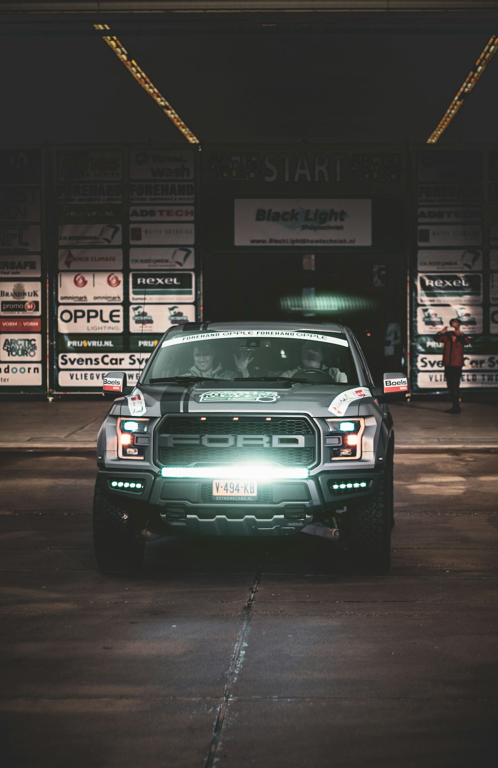 white and black car on road during night time