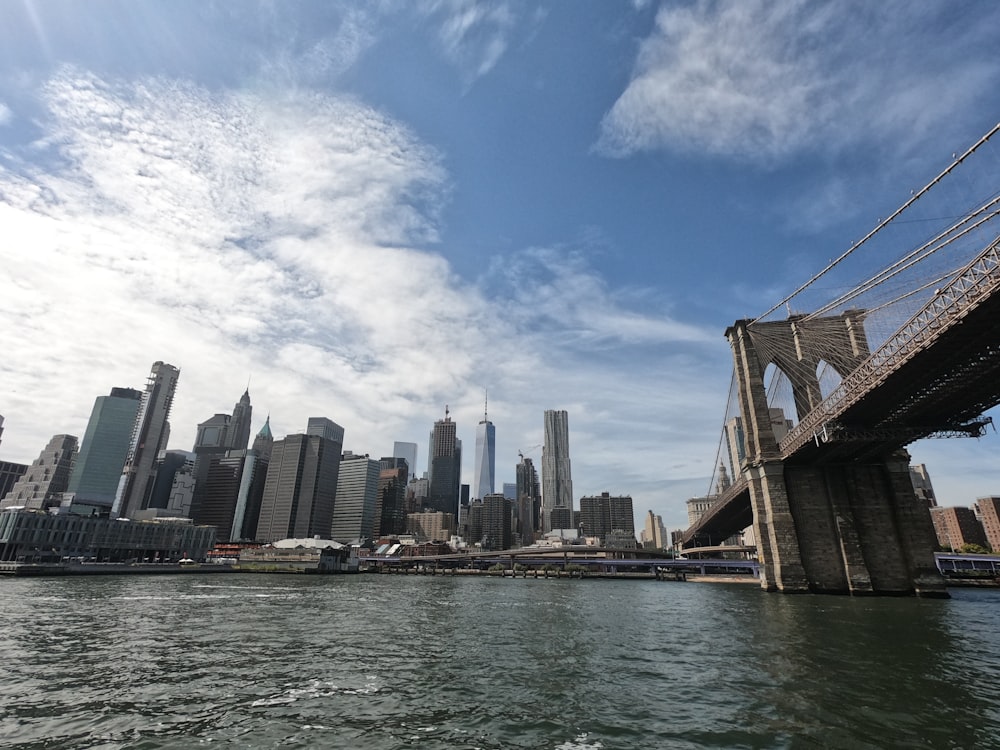 high rise buildings near body of water under blue sky during daytime