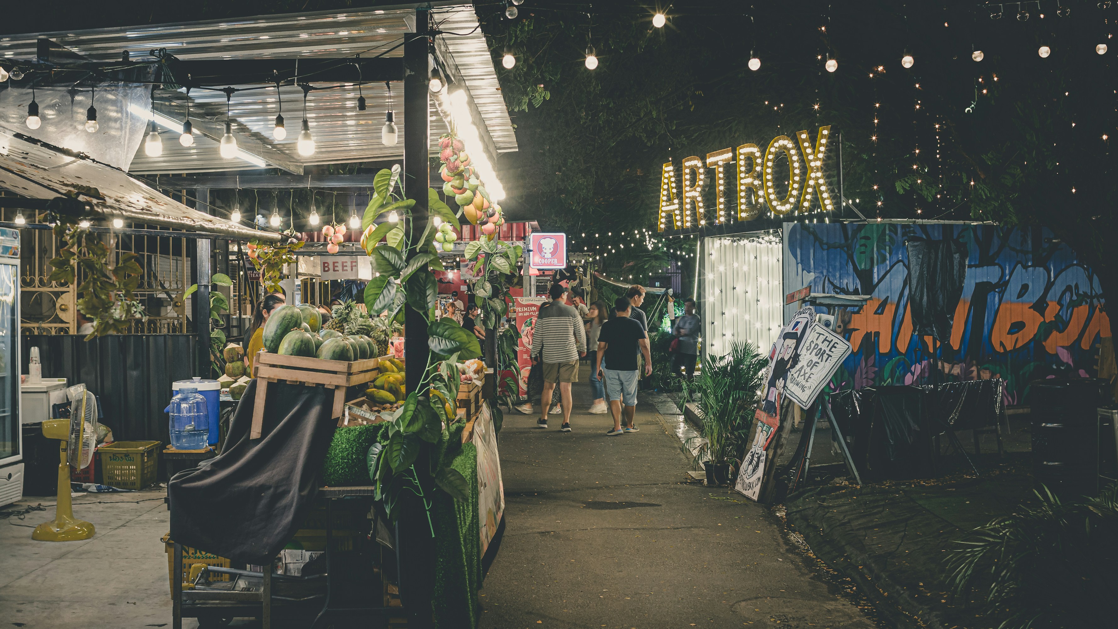 people walking on market during nighttime