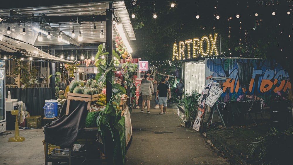 people walking on market during nighttime