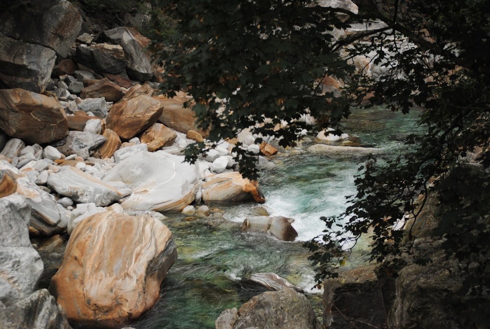 brown rock formation near body of water during daytime