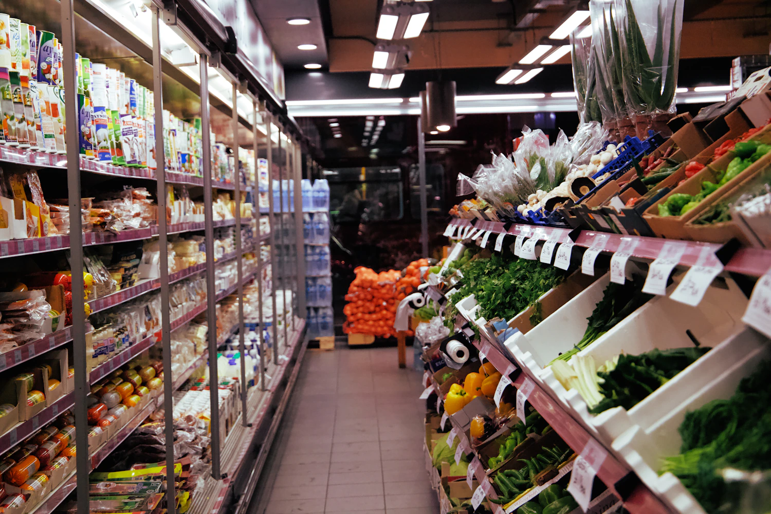 Retail employee scanning products at a checkout counter