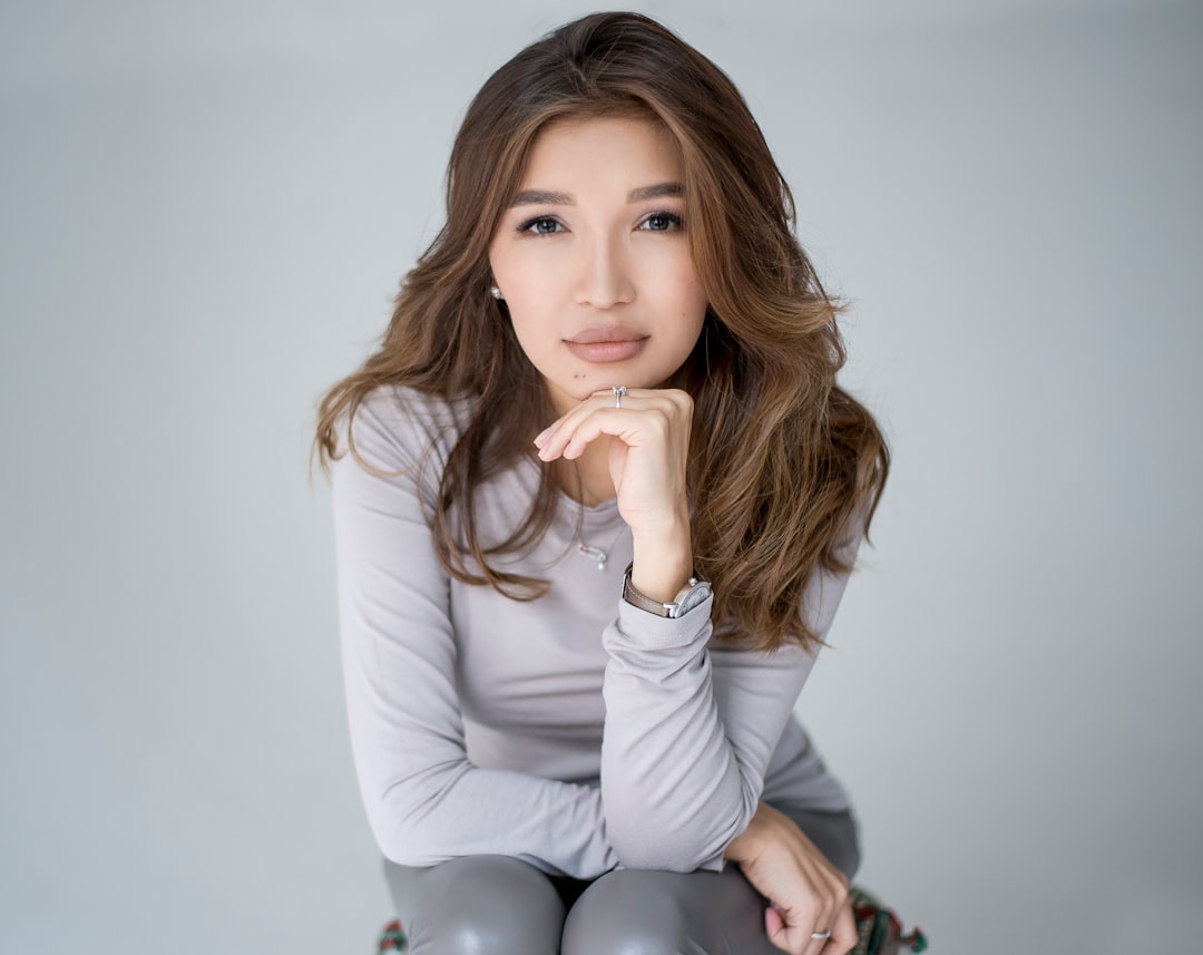 woman in white long sleeve shirt and black pants