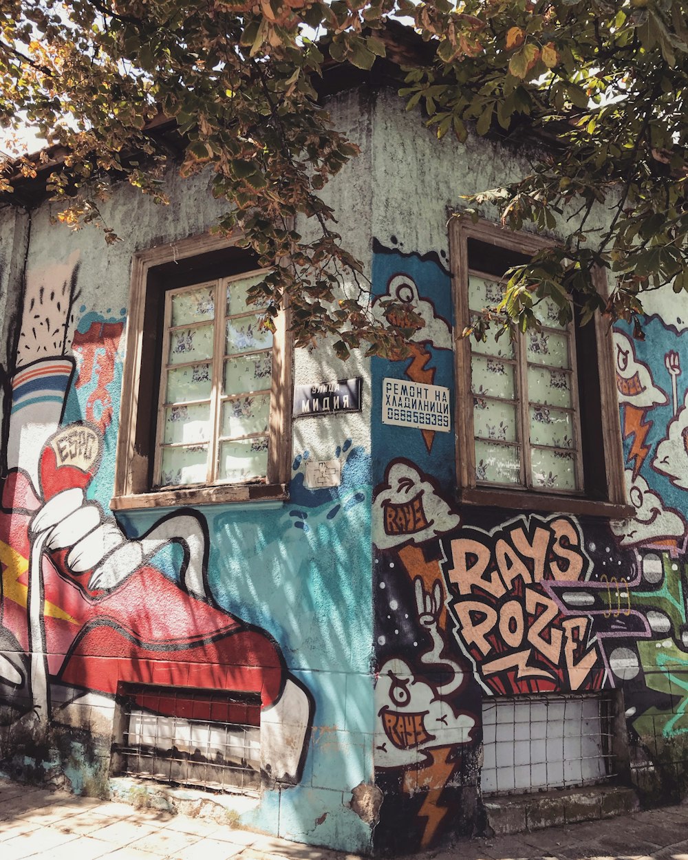 blue and red graffiti on wall