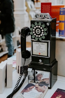 black and silver telephone on black and white wooden table