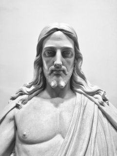 A half-body 3D sculpture of a man in a subtle smile, showing intricate hair and clothing textures.