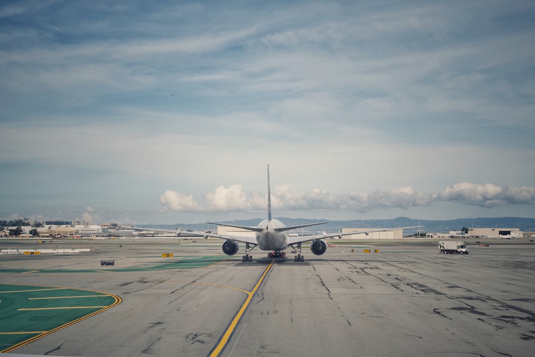 white airplane on airport during daytime