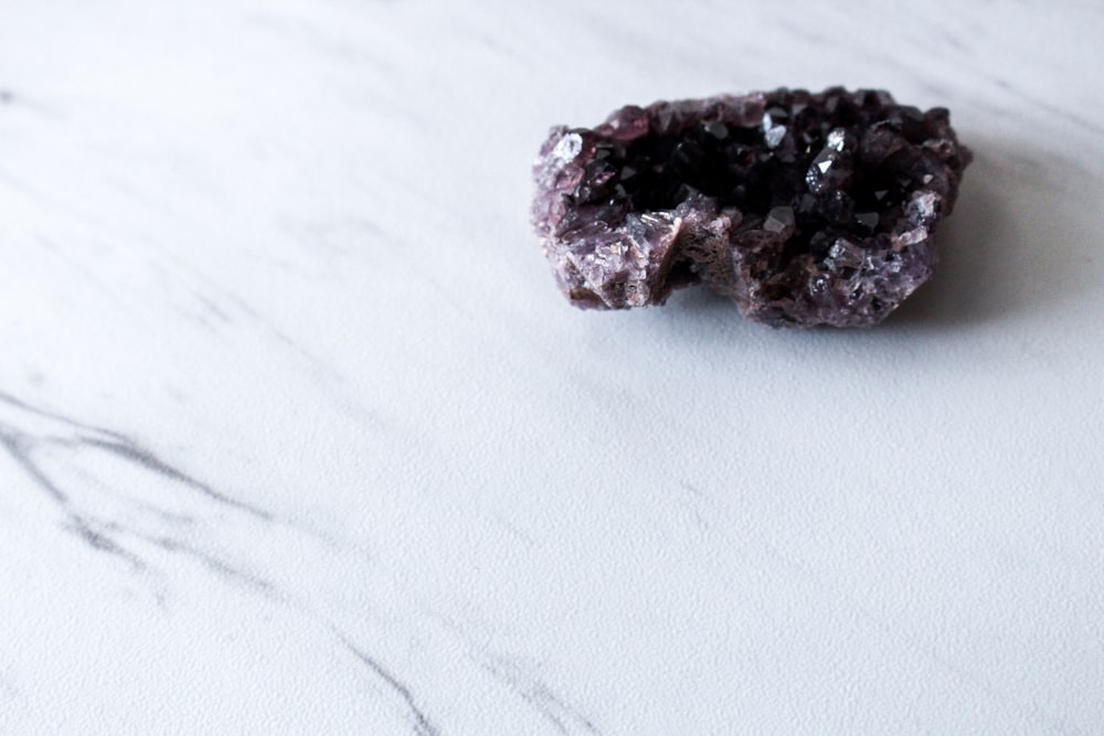 brown and gray stone on white textile