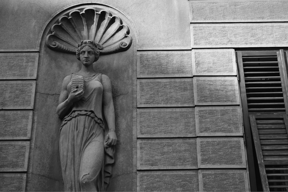 gray concrete angel statue during daytime