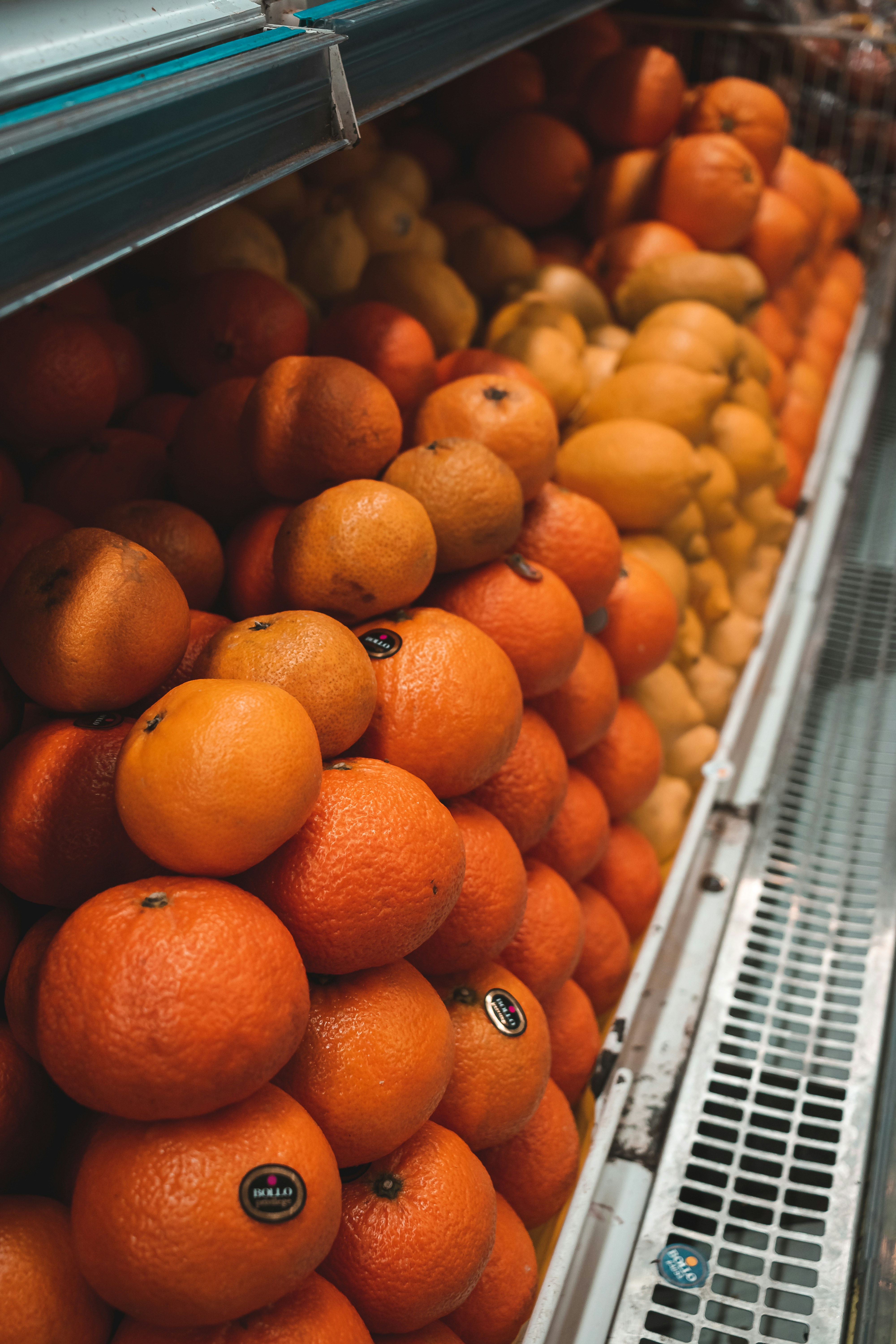orange fruits on white plastic container