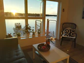 A cozy interior shot of a staged living room ready for a new homeowner in the Lakes Region.