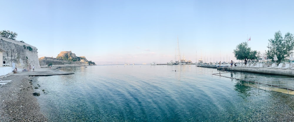 white boat on sea during daytime