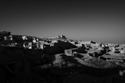 grayscale photo of city buildings iraq google meet background