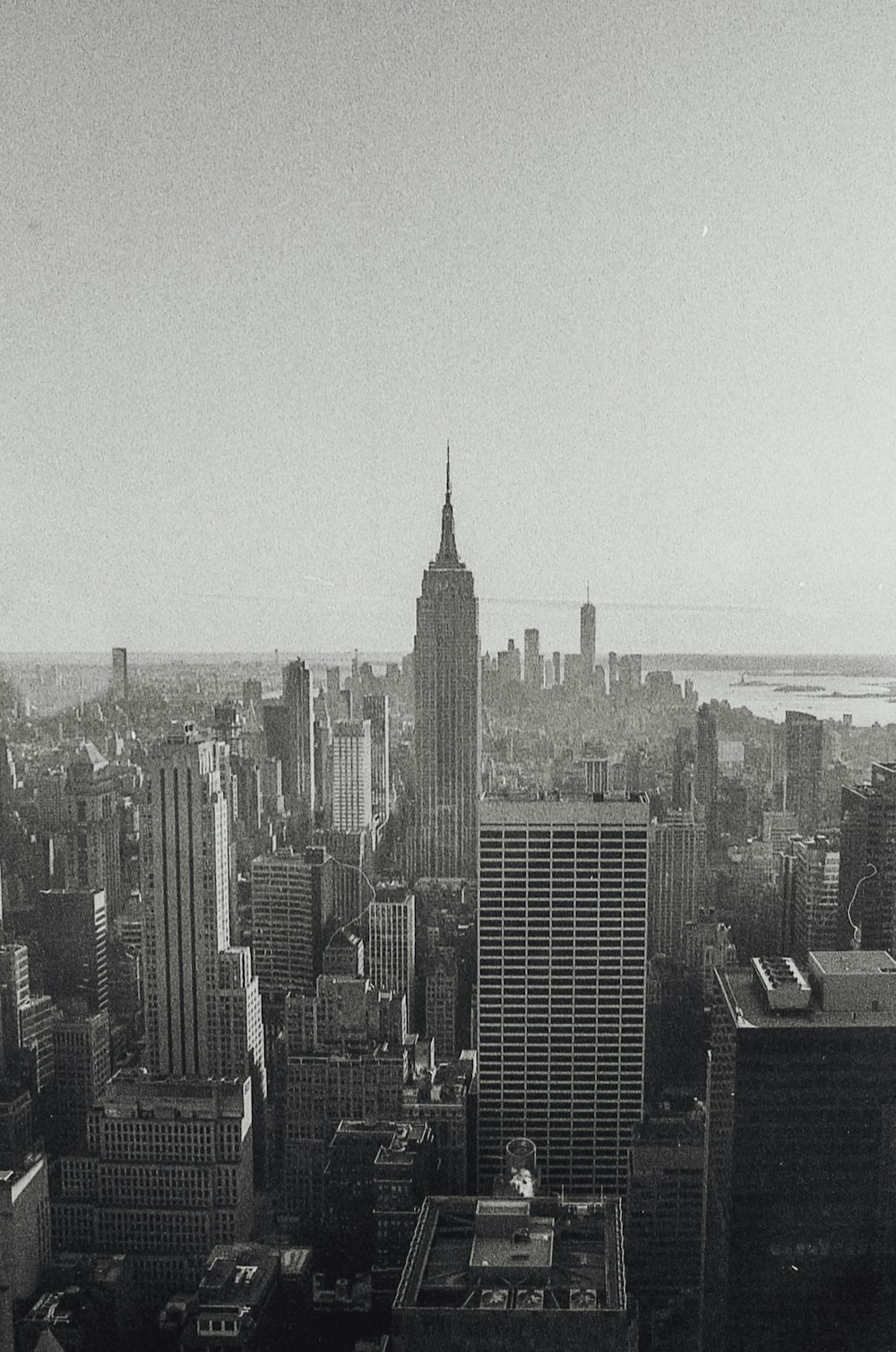 grayscale photo of city buildings