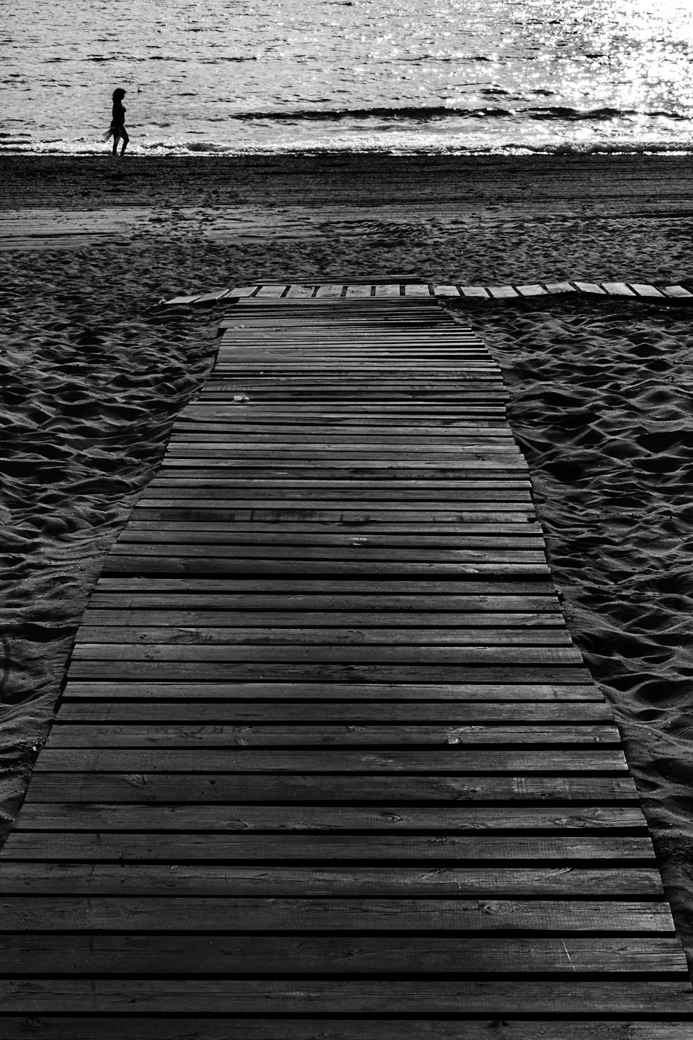 grayscale photo of wooden dock