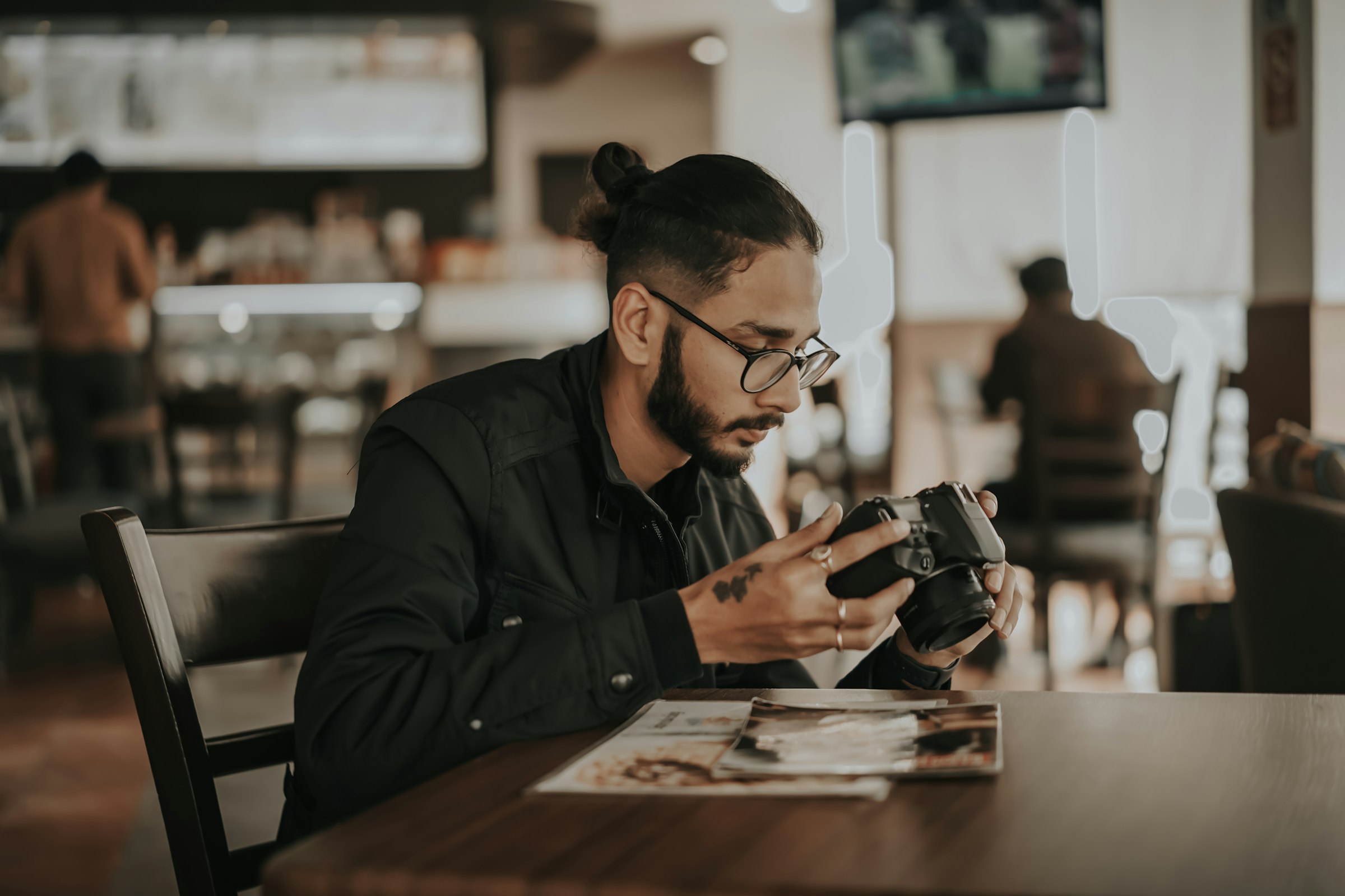 photographer looking frustrated while reviewing identical portraits on camera LCD