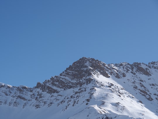 snow covered mountain under blue sky during daytime in Savoie France