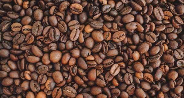 brown coffee beans on brown wooden table