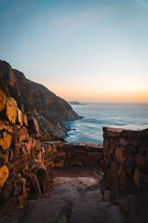 A scenic view of Iceland's rugged coastline at sunset.