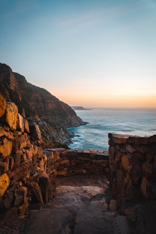 A scenic view of Iceland's rugged coastline at sunset.