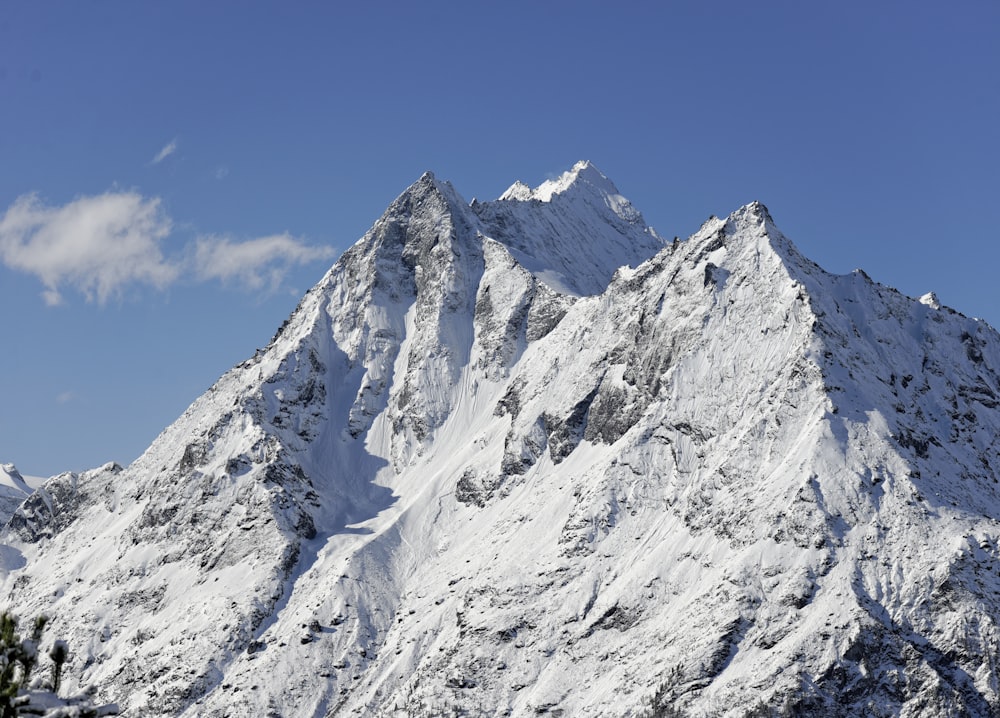 snow covered mountain under blue sky during daytime