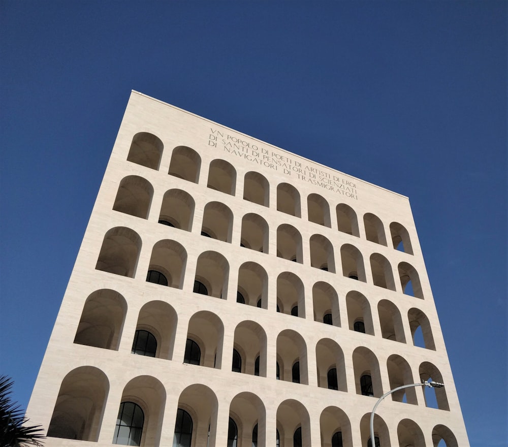 white concrete building under blue sky during daytime