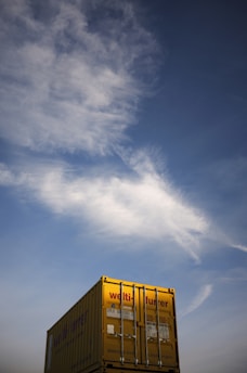 yellow and white building under blue sky