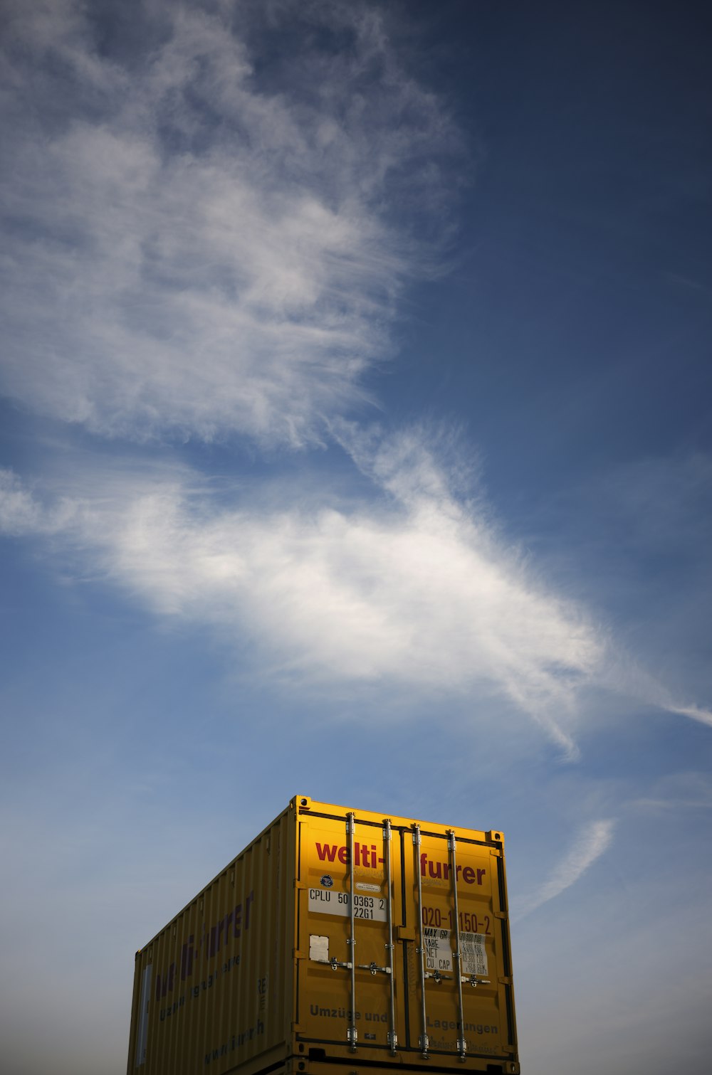 yellow and white building under blue sky