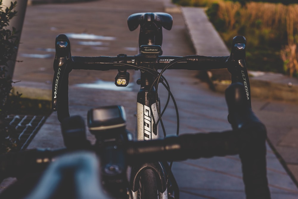 black city bike on road during daytime