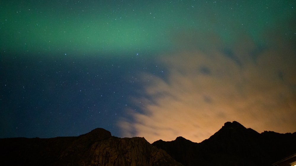 brown mountain under blue sky during night time