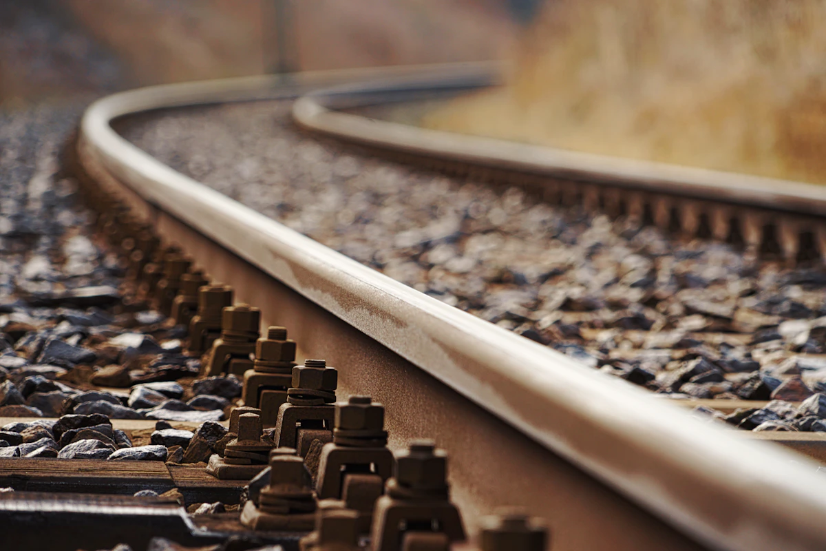 Passenger train arriving along elevated railway tracks