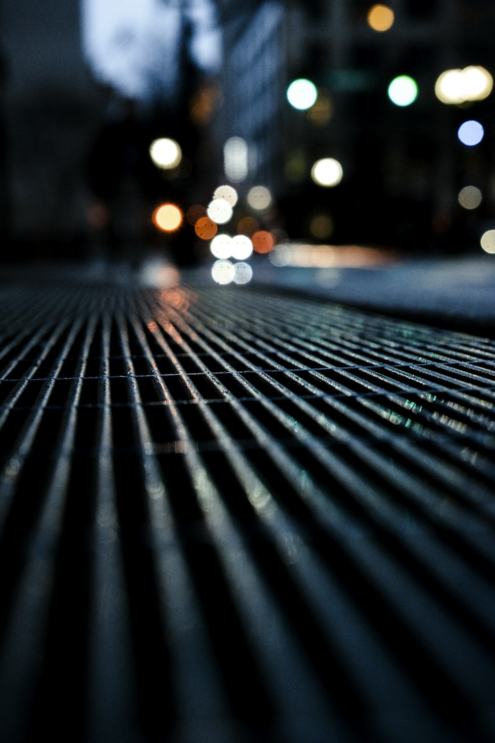 black metal fence during night time