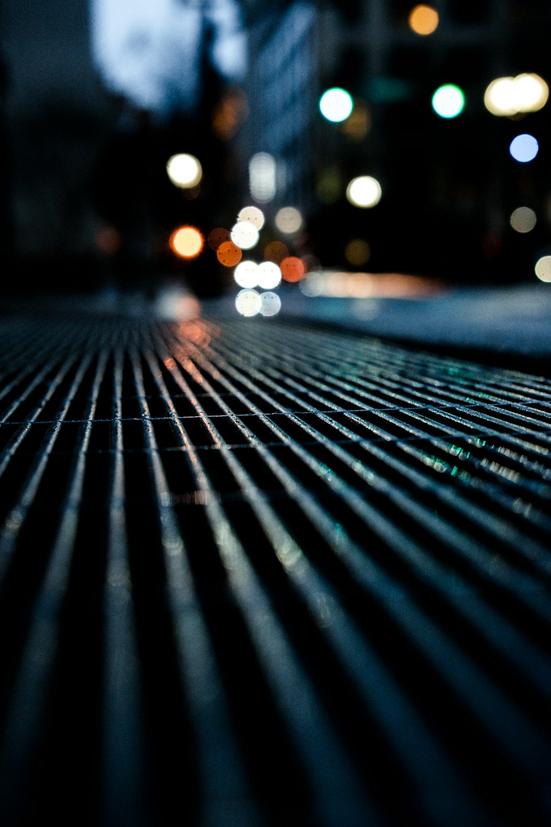 black metal fence during night time