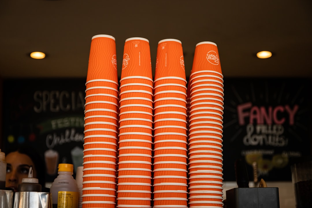 orange and white plastic cups
