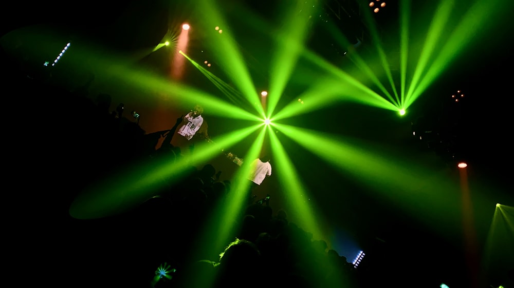 man in black shirt standing on stage