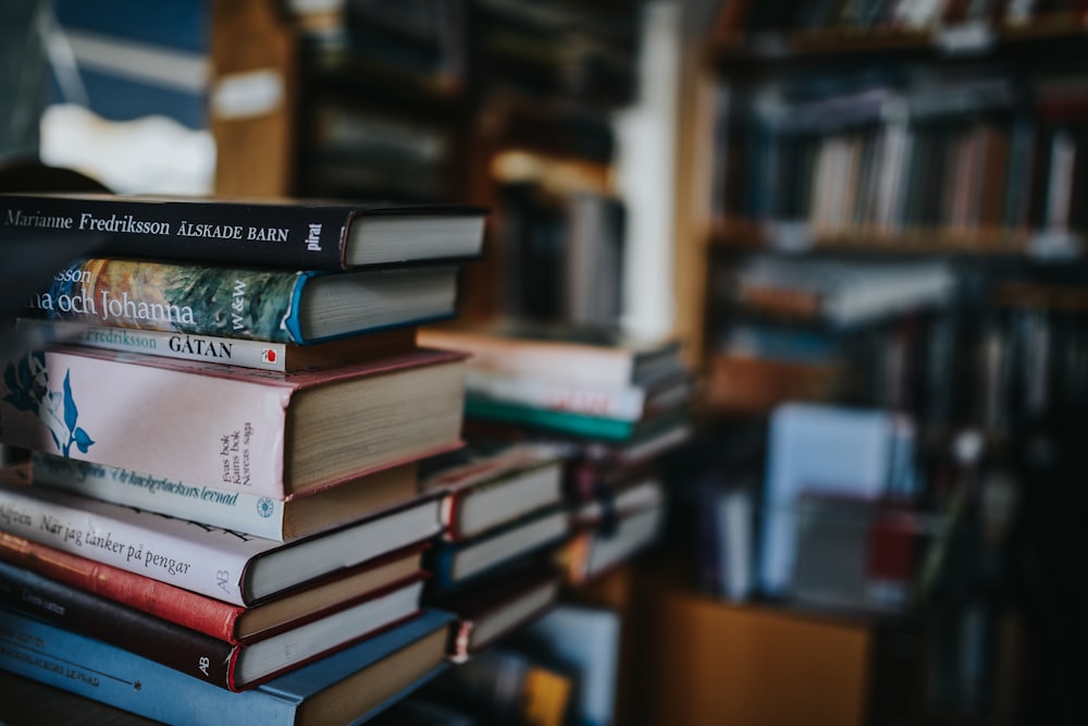 books on brown wooden shelf