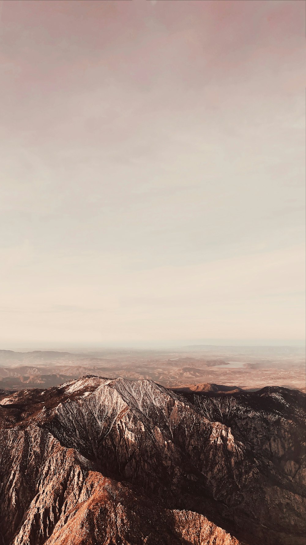 brown mountains under white sky during daytime