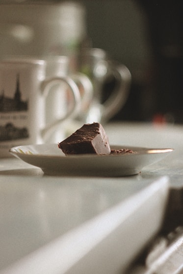 sliced chocolate cake on white ceramic plate