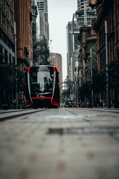 A modern tram navigating through a bustling European city street, showcasing smooth integration with urban infrastructure.