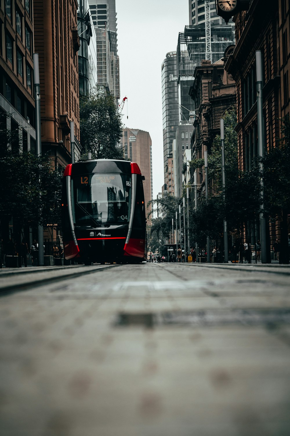 black and white train on the city during daytime