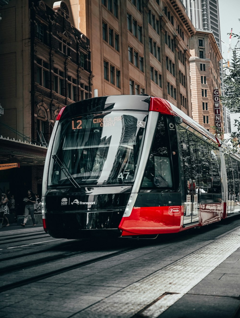 red and white tram on road during daytime