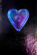 purple heart shaped ornament on black and white textile
