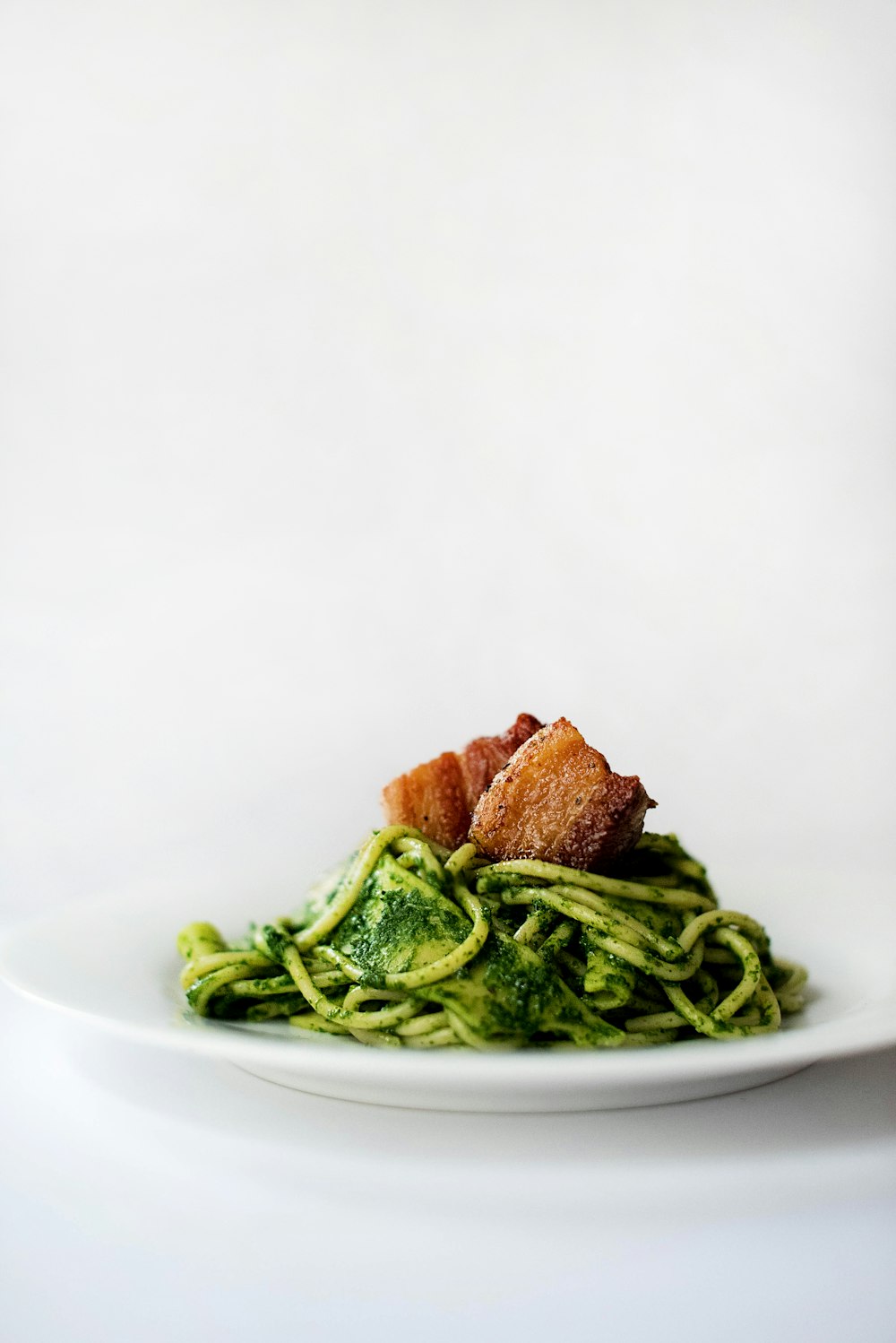 green vegetable on white ceramic plate