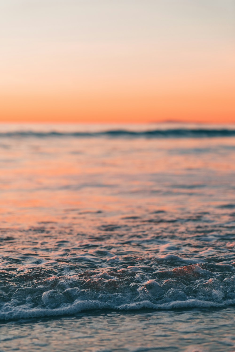 body of water during sunset